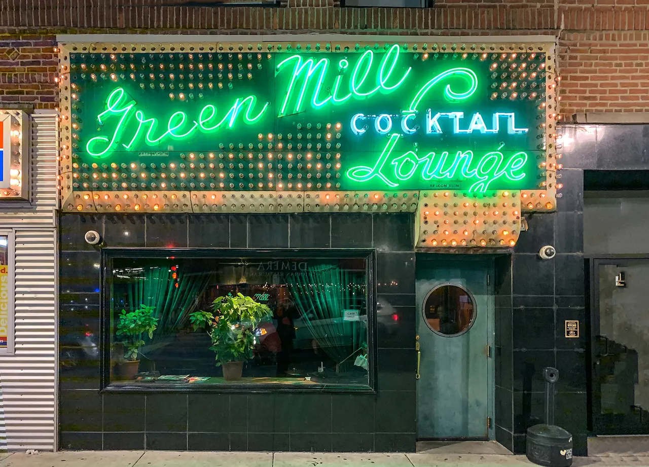 The Green Mill’s neon sign on North Broadway.