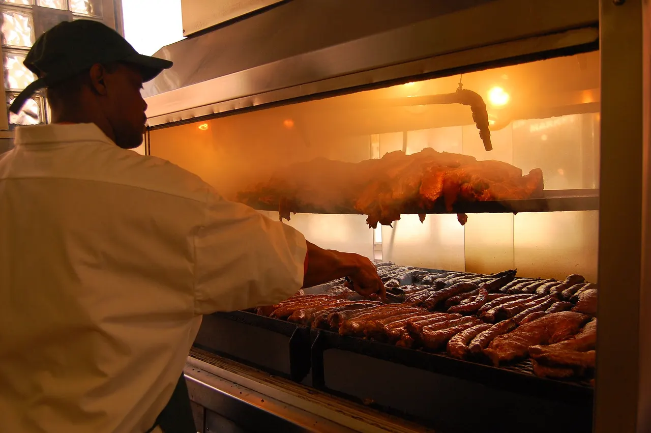 Meat cooking in the aquarium smoker at Lem’s Bar-B-Q.